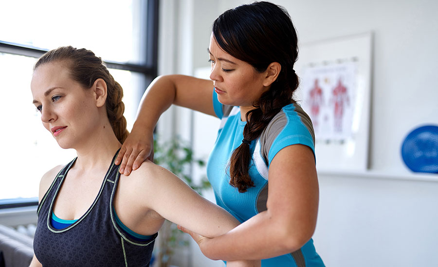 A therapist massaging a patient